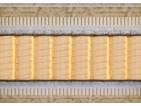 Close-up cross-section of Schramm Divina handcrafted mattress showing the natural material layers including horsehair, cotton wadding, and a traditional spring core