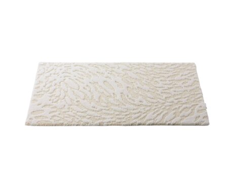 Abyss & Habidecor Flow luxury bath mat with abstract textured design in soft ivory cotton