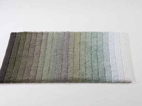 Abyss & Habidecor Maior bath mat features a modern striped gradient design in earthy and soft pastel tones with plush cotton texture