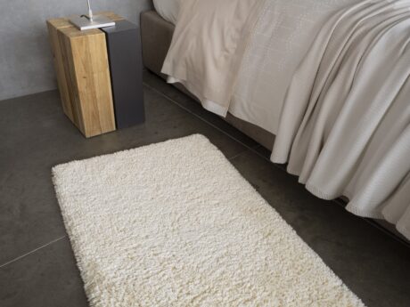 Abyss & Habidecor Shag bath mat in ivory inside a room