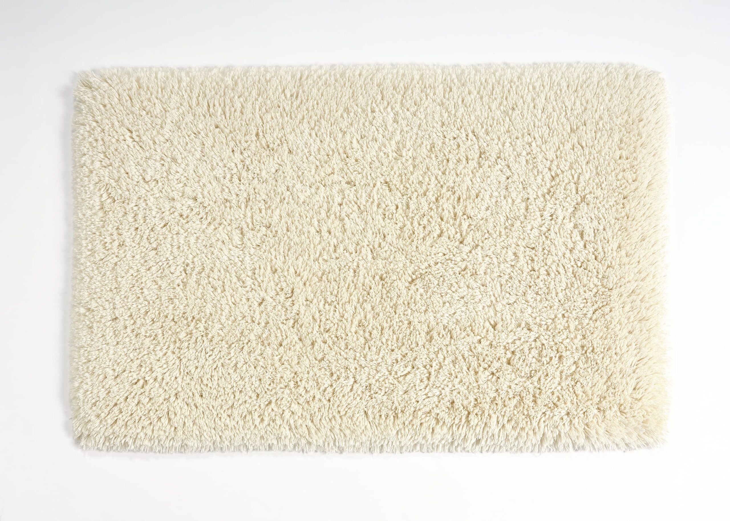 Abyss & Habidecor Shag bath mat in ivory