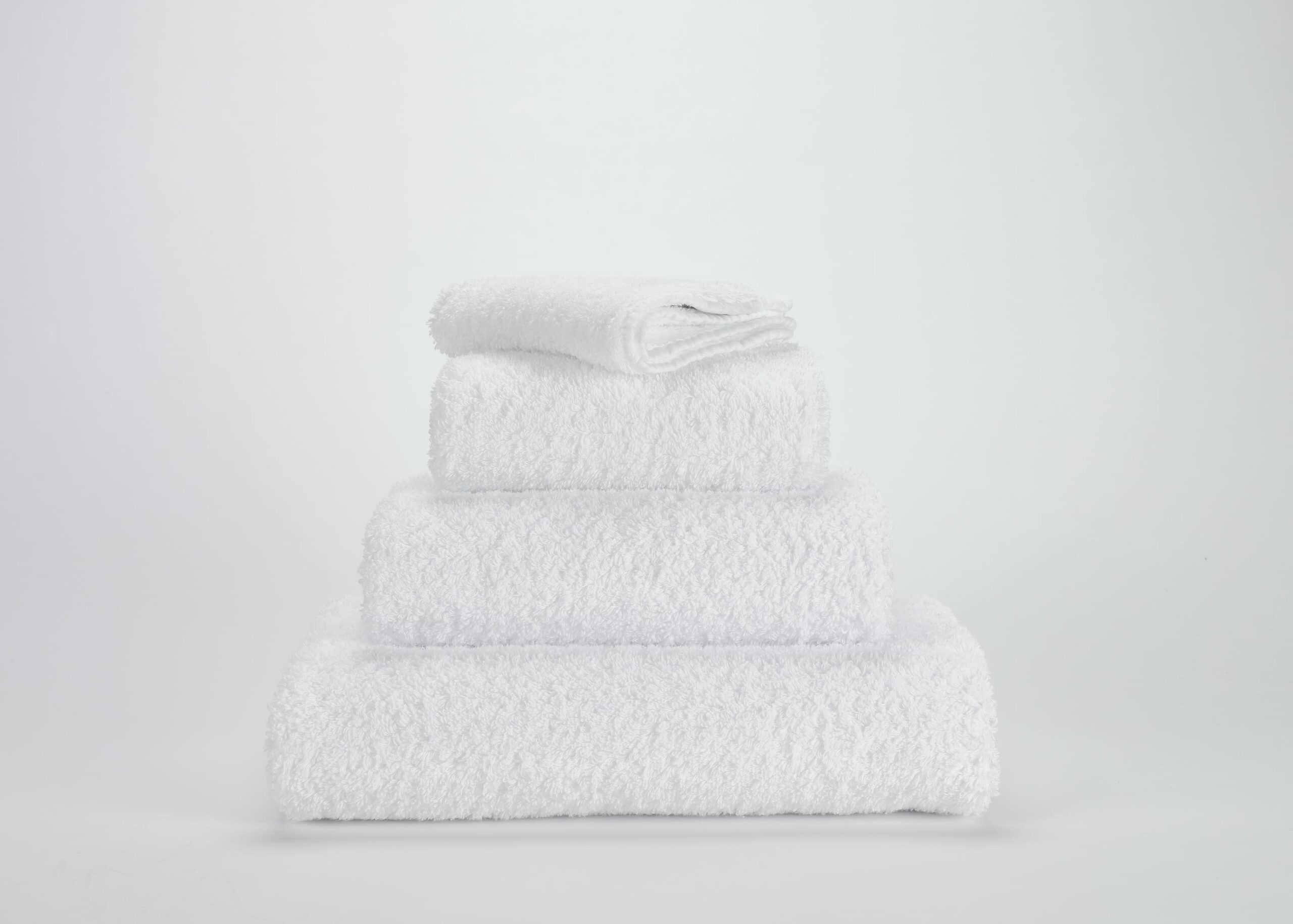 Abyss & Habidecor Super Pile 100 luxury white cotton towel set stacked