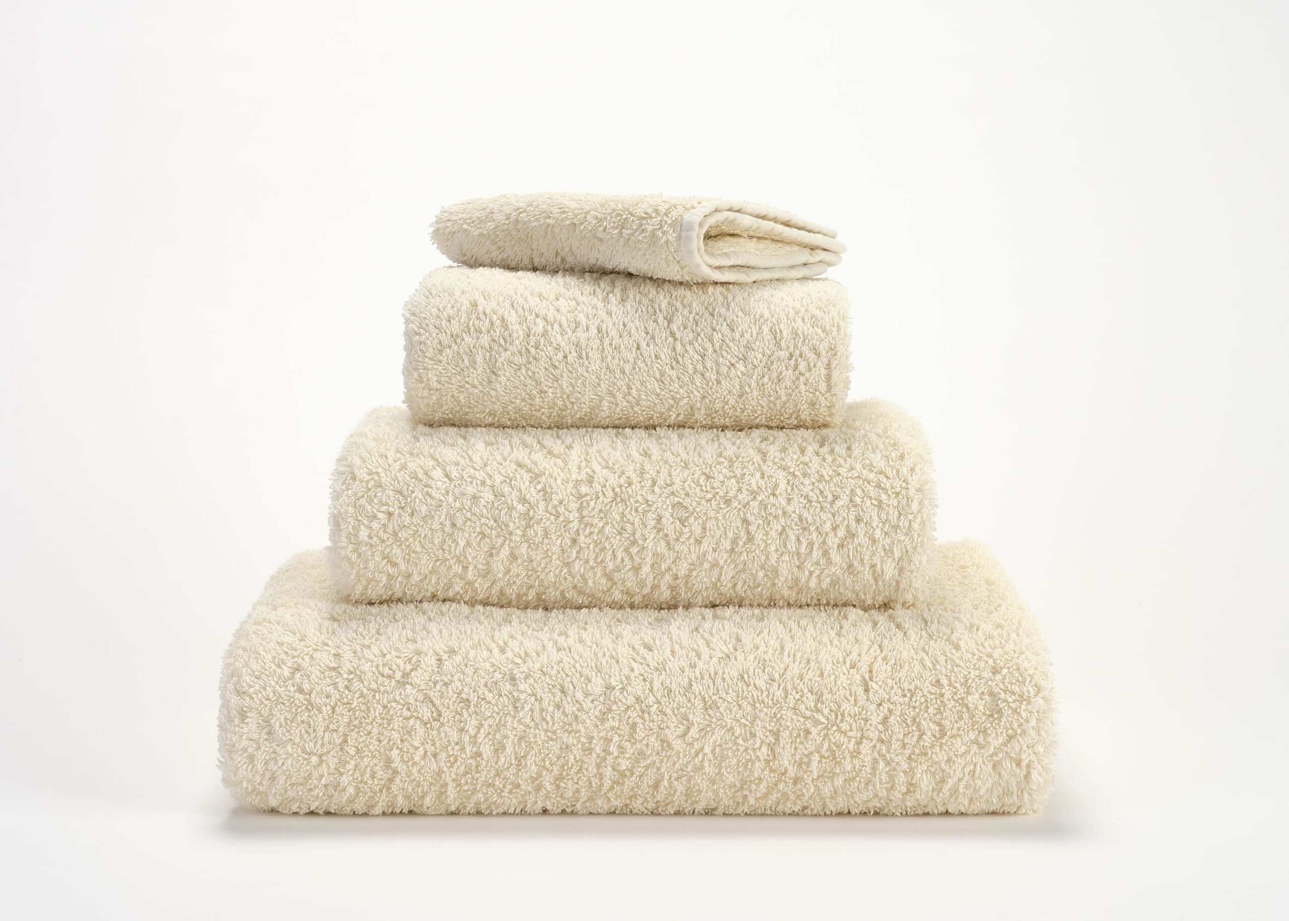 Abyss & Habidecor Super Pile 101 luxury cotton towels in ivory stacked