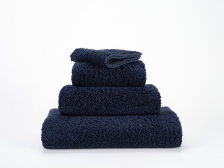 Abyss & Habidecor Super Pile 314 luxury cotton towels in navy stacked