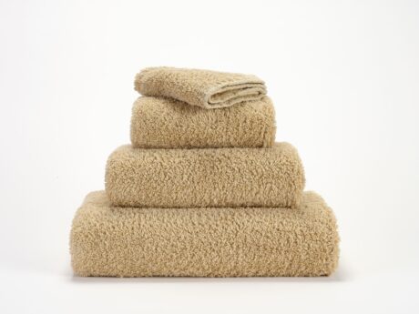 Abyss & Habidecor Super Pile 714 luxury cotton towels in beige stacked
