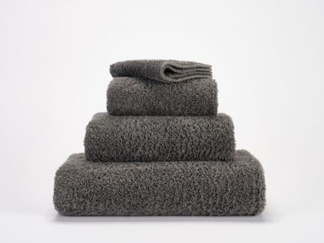 Abyss & Habidecor Super Pile 920 luxury cotton towels in charcoal grey stacked