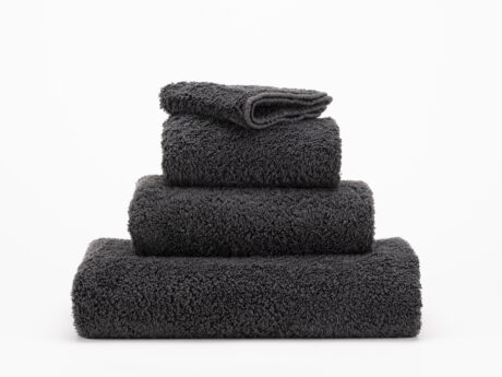 Abyss & Habidecor Super Pile 997 luxury cotton towels in dark charcoal stacked