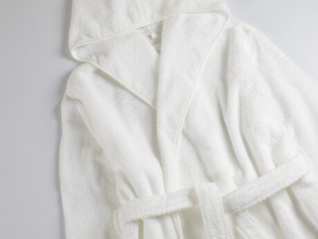 Uchino CL Zero Twist hooded bathrobe in white laid flat with belt