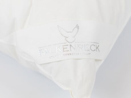 Close-up of Falkenreck Genusskissen premium down pillow embroidered logo