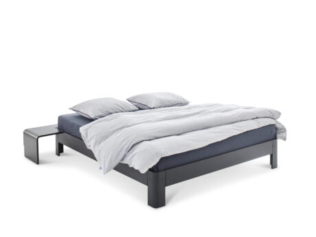 Auping Auronde bed front angle view with dark frame and white duvet