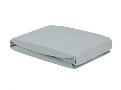 Christian Fischbacher Jersey Uni fitted sheet folded in light grey, showing the soft matte cotton jersey surface and deep elasticated corner