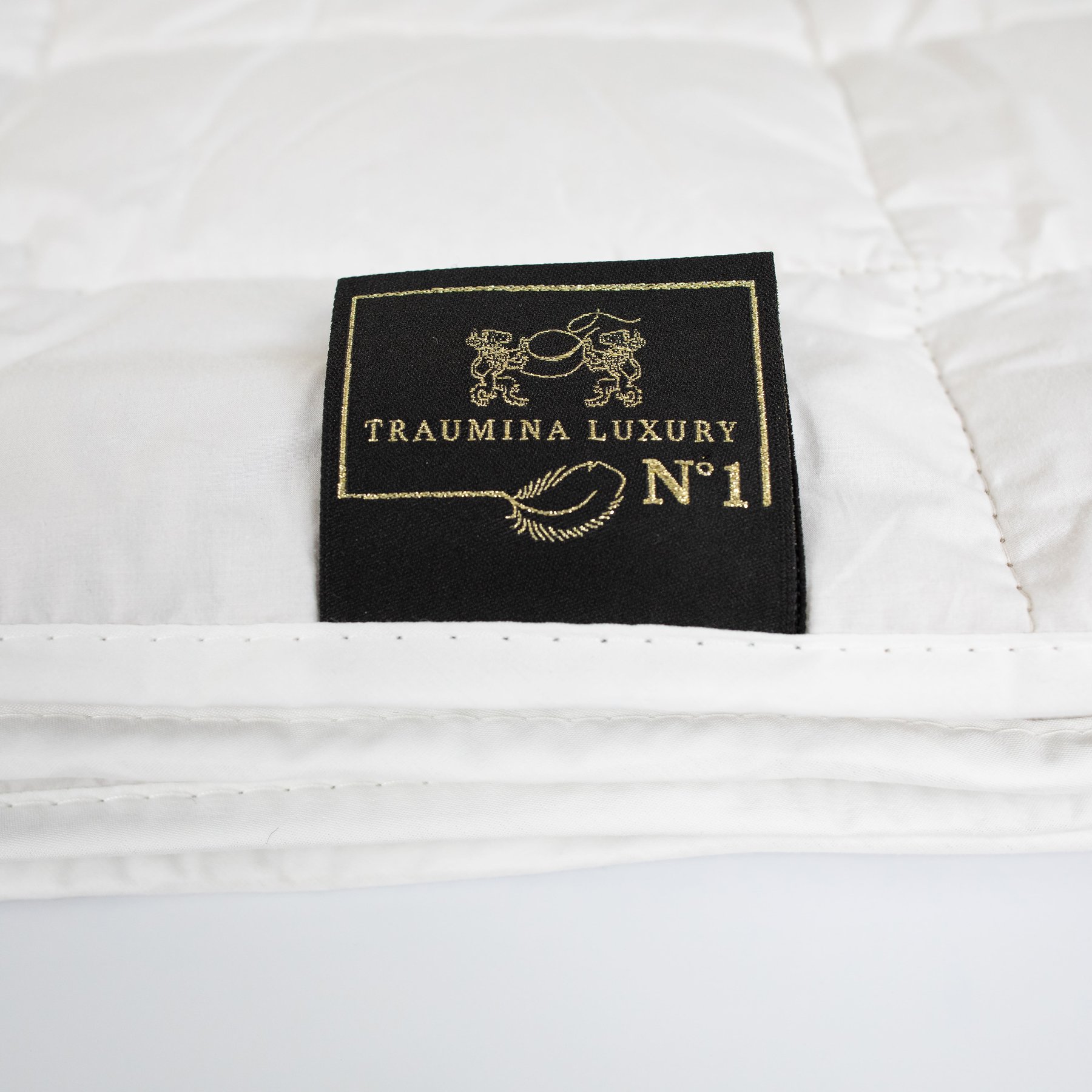 Close-up of Traumina Luxury N°1 embroidered brand label