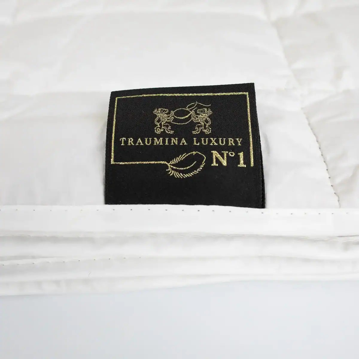 Close-up of Traumina Luxury N°1 embroidered brand label