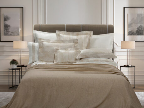 Dea Lavaredo cashmere and linen bedspread in beige on a double bed