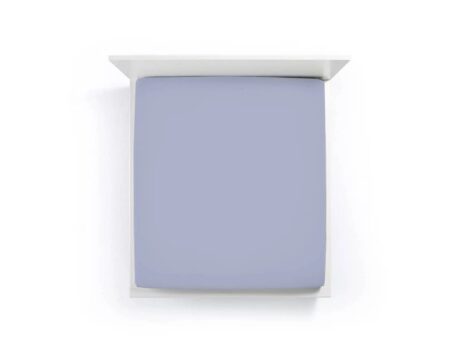 Bella Donna Formesse Jersey denim blue fitted sheet on mattress showing smooth wrinkle-free fit and soft blue-grey color
