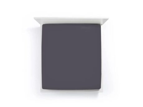 Bella Donna Jersey anthracite fitted sheet on mattress showing smooth wrinkle-free fit and dark grey color