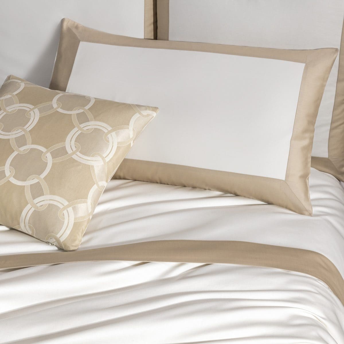 Frette Bold pillowcase on a made bed