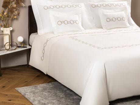 Frette Links Embroidery bed linen set on a double bed