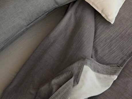 Society Limonta Miro flat sheet in tisana on a bed
