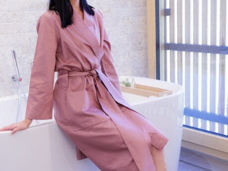 Von der Thannen Clay satin kimono hanging on a door
